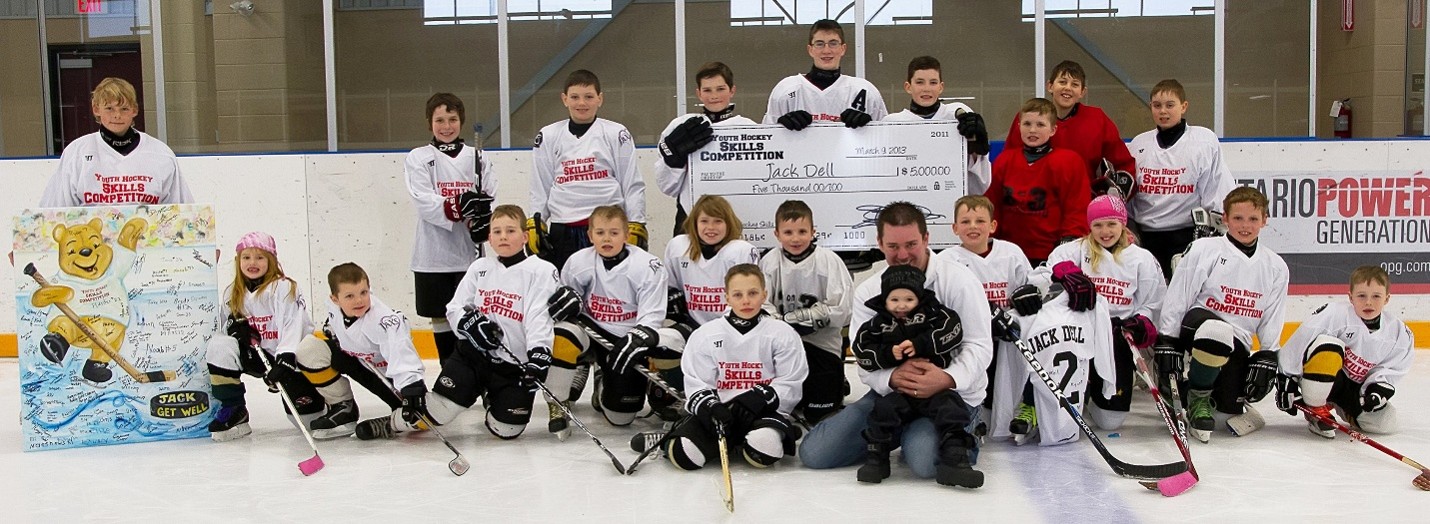 Youth Hockey Skills Competition team photo with a $5,000 fundraising cheque for Jack Dell